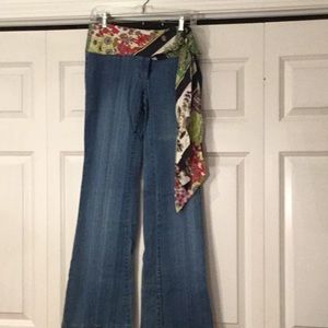 Flared jeans with silk floral waistband and sash